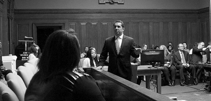 Attorney Brian Spitz addressing someone in a courtroom.