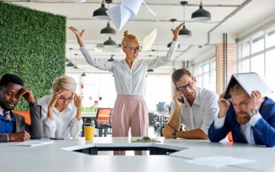 Female manager yelling at employees in a hot office.