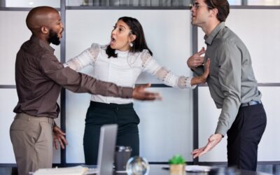 Workplace hallway with tense interaction between two employees.