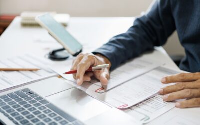 Employee reviewing documents while considering options after workplace discrimination.