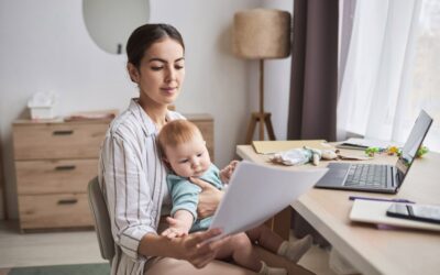 Parent reviewing workplace documents and calendar while worrying about a child’s medical treatment.