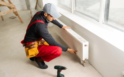 Plumber repairing pipes inside a commercial building.