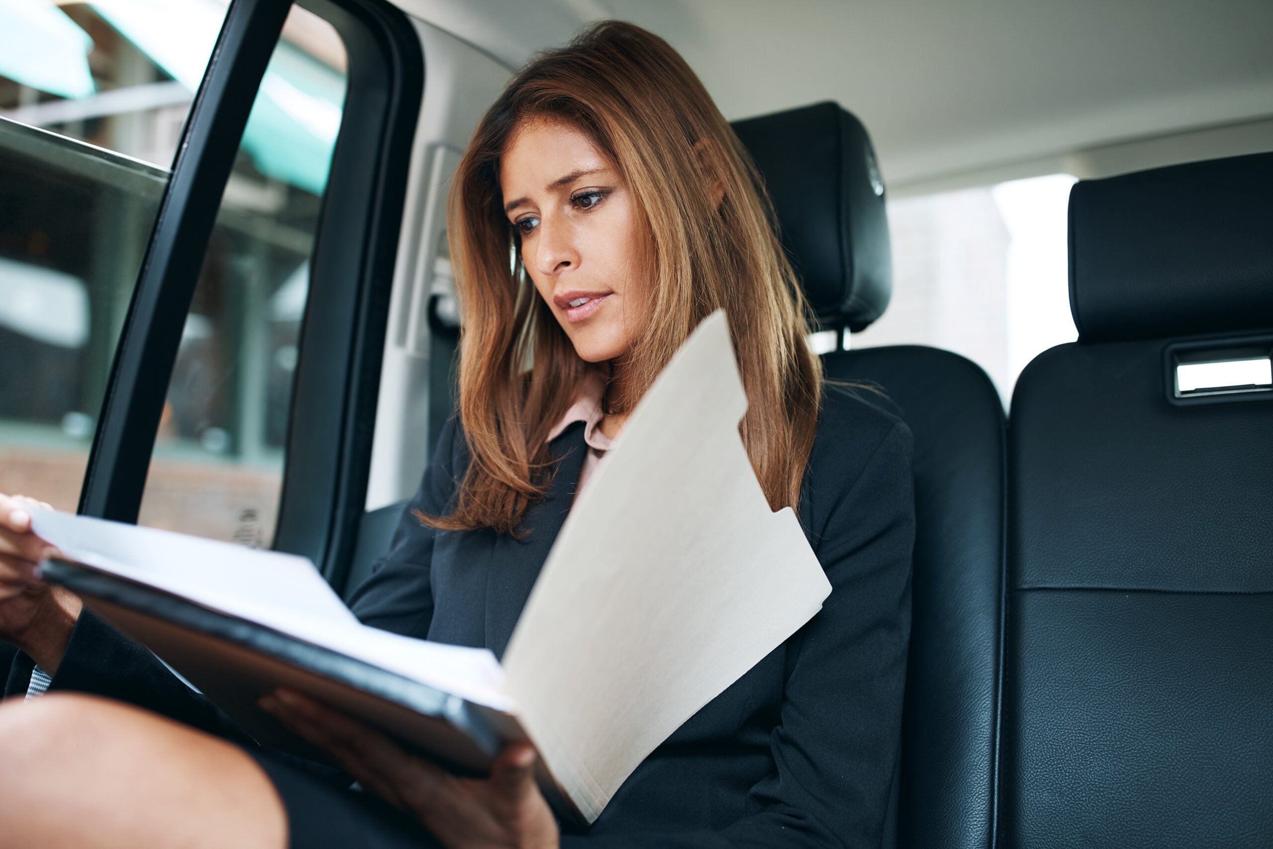 Employee reviewing court documents looking frustrated after losing a workplace lawsuit 