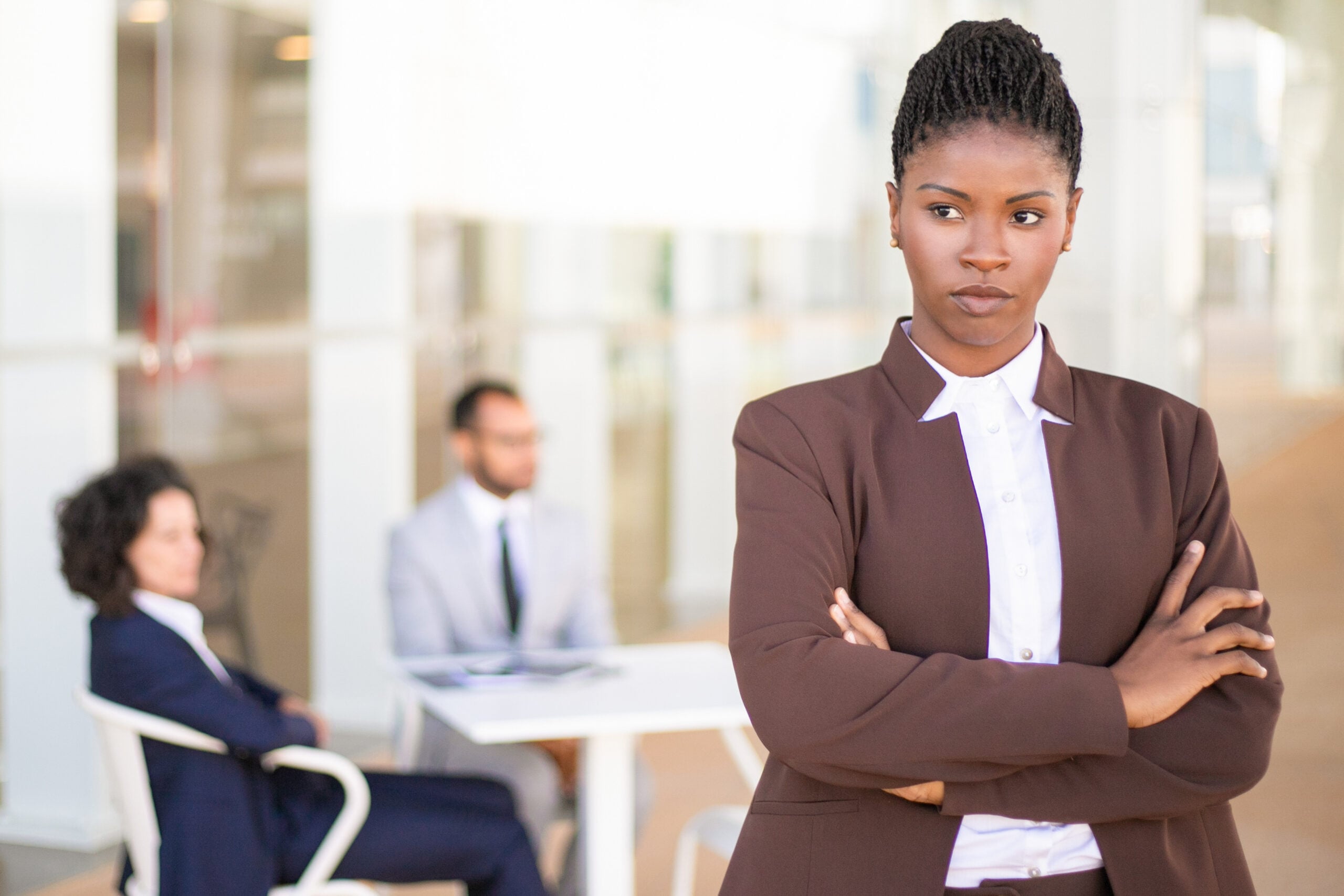 Black employee reacting to offensive racist comment from supervisor at work