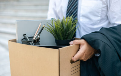 Employee being escorted out of workplace after termination without warning