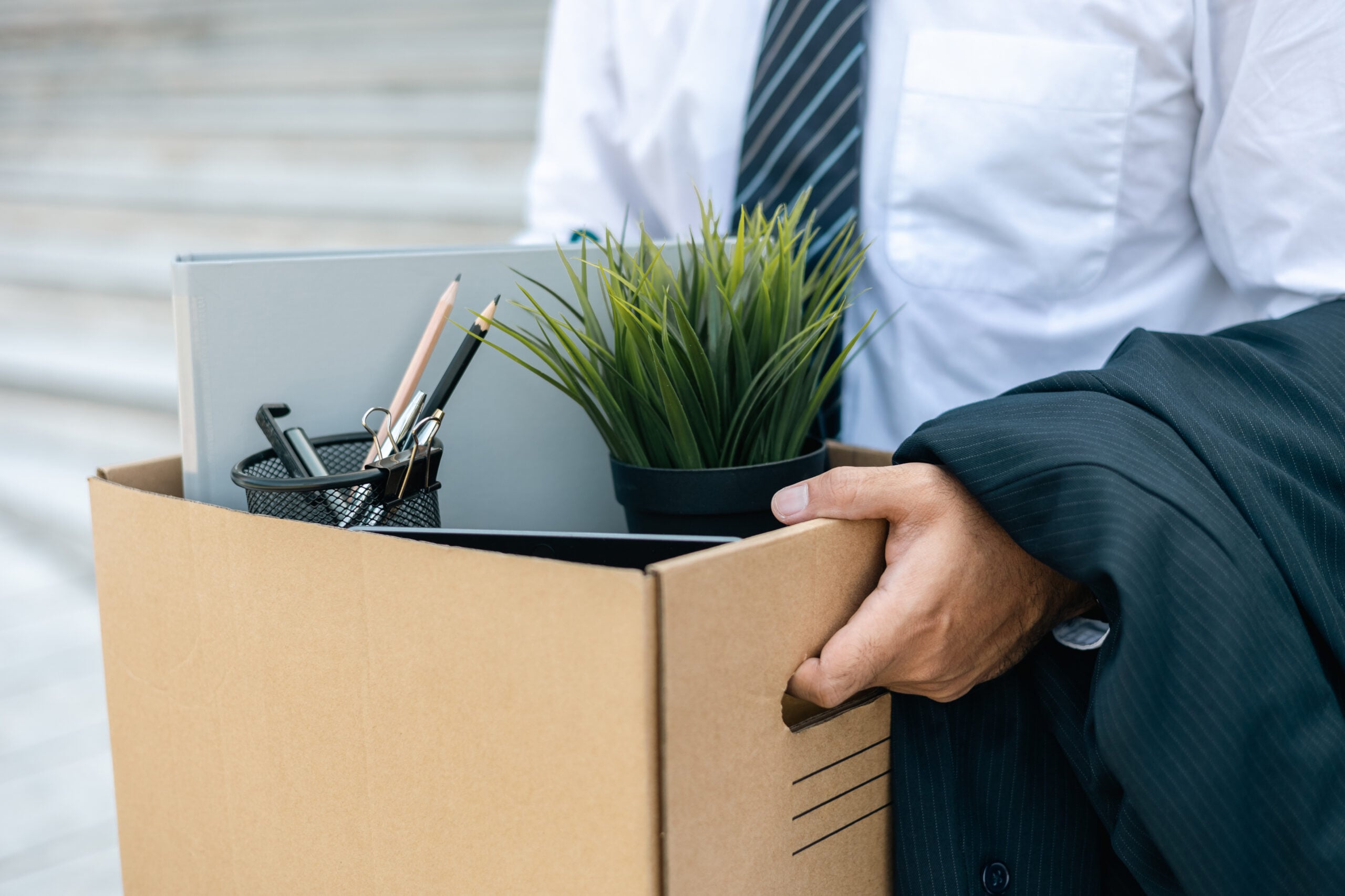 Employee being escorted out of workplace after termination without warning