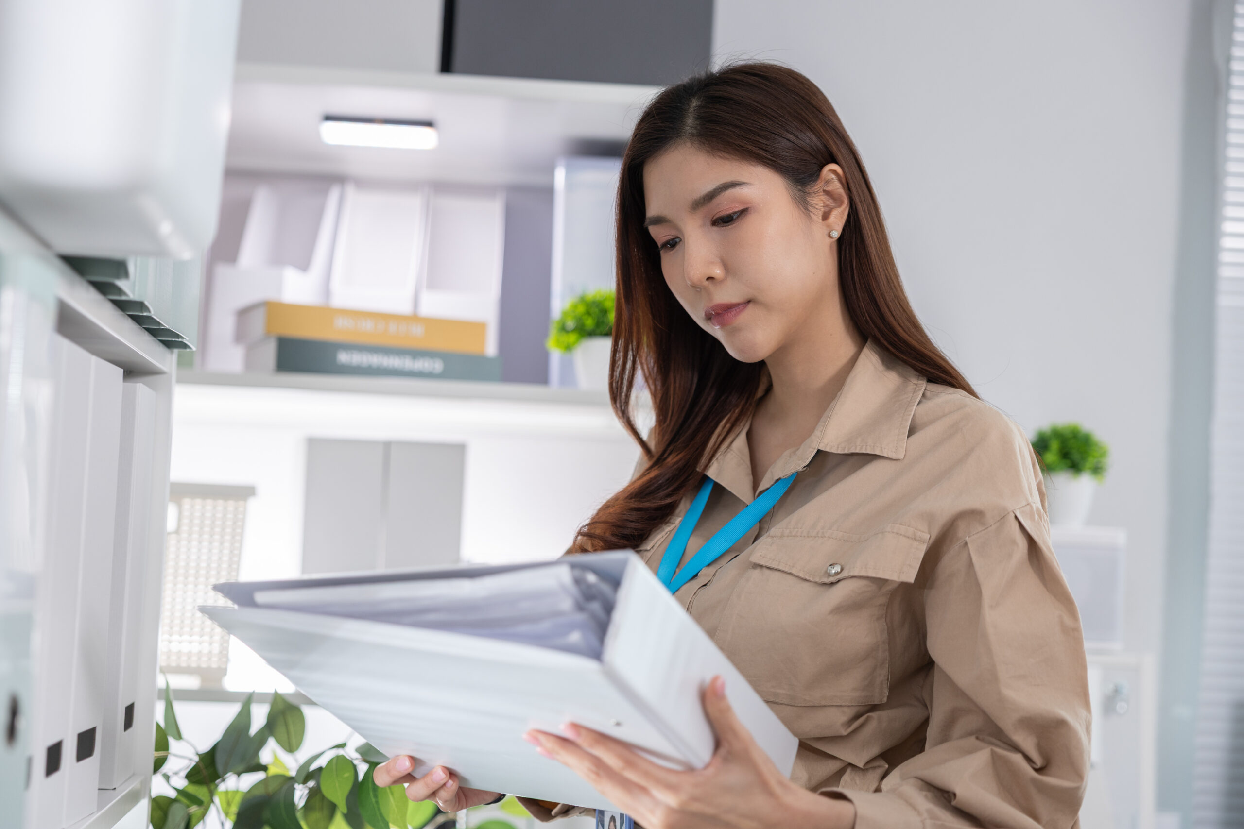 Employee reviewing discipline records, workplace complaint notes, and termination documents after reporting gender discrimination.