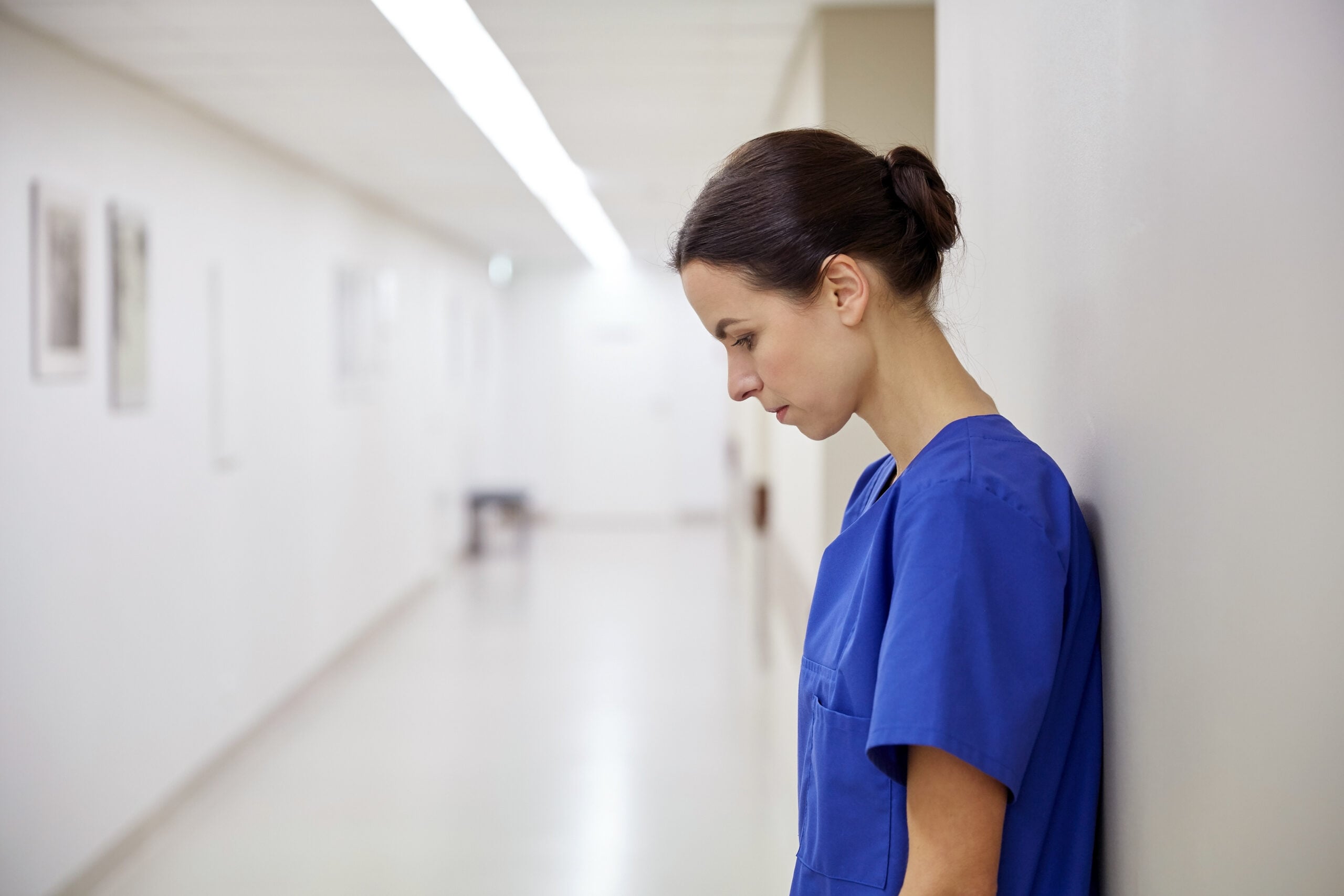 Hospital employee requesting a disability accommodation before being wrongfully terminated, illustrating ADA disability discrimination, reasonable accommodation, and retaliation claims.