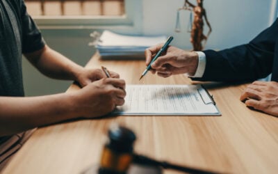 Person reviewing a stack of court papers while handling a Title VII employment discrimination lawsuit without an employment lawyer.