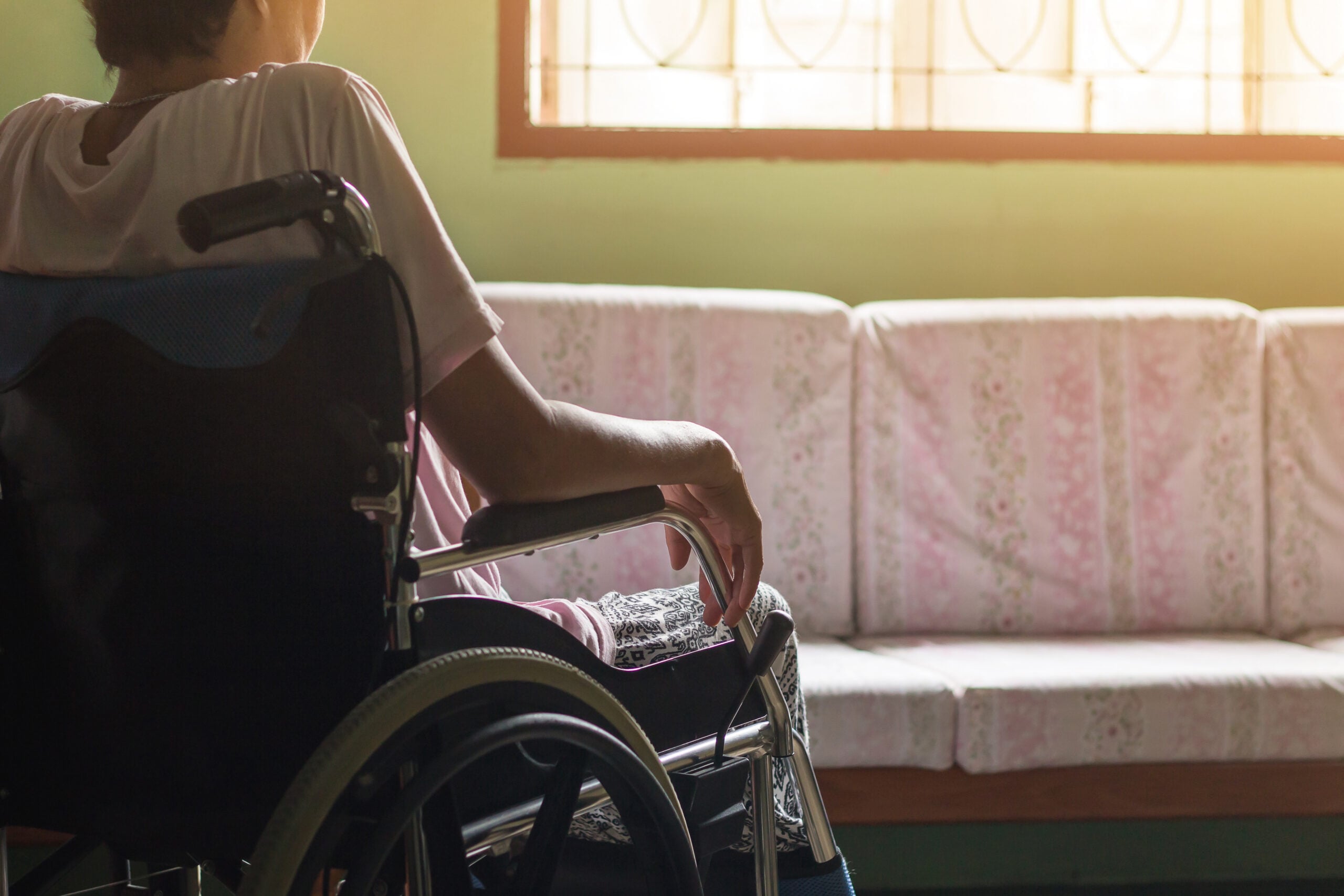 Employee sitting at home after being placed on unpaid medical leave while vacant jobs remain available, illustrating disability accommodation under the ADA